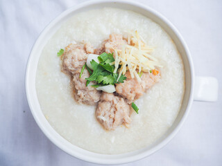 Top view of Rice porridge with minced pork, sliced ginger