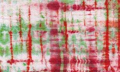 red and green background with tie dye pattern textile fabric cotton cute gorgeous modern wallpaper design. colorful graffiti flat lay batik ,red green surface canvas.