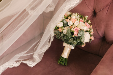 Wedding bouquet of the bride on a pink background