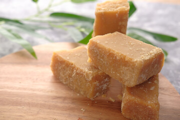 stack of Jaggery traditional cane sugar cube on table 