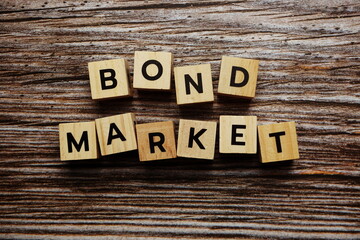 Bond Market alphabet letter on wooden background