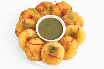 Aloo Tikki Also Known As Alu Ki Tikkia Is Seasoned Boiled Mashed Potato Cutlet Or Patties Used In Various Indian Street Food Masala Chaat Snacks With Green Chutney. White Background And Copy Space