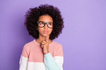 Portrait of sad curly hairdo girl look empty space hand chin wear spectacles white sweater isolated...