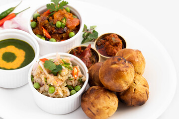 Litti Or Liti Chokha - Round Wheat Dough Drenched In Desi Ghee And Stuffed With Spicy Bengal Gram Flour Chana Sattu Is Served With Baingan Bharta Prepared By Mincing Eggplant Roasted On Charcoal Fire