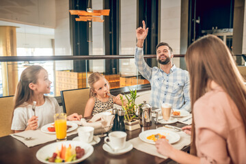 Cute family spending time together at breakfast