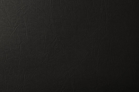レザー調のシワ加工のある黒い紙の背景テクスチャー © hanahal