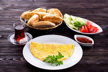Assorted Middle Eastern and arabic dishes on a dark rustic background. Hummus, tabbouleh, pita, meat kebab, falafel, baklava. Halal food. Top view. Turkish foods, Turkish pizza, Turkish breakfast