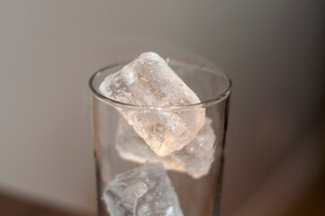 Ice cubes in a glass, close-up. Selective focus.