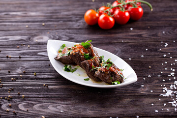 Assorted Middle Eastern and arabic dishes on a dark rustic background. Hummus, tabbouleh, pita, meat kebab, falafel, baklava. Halal food. Top view. Turkish foods, Turkish pizza, Turkish breakfast