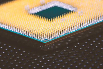 Close-up of a part of a microprocessor in soft focus under high magnification. Details of a computer component under a microscope.