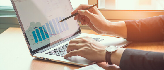Banner photo of business meeting time a financial managers working with new project and using Notebook on wood table. a Financial Plan Presentation, financial business concept