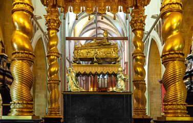 Gniezno Cathedral interior with symbolic sarcophagus and coffin of St. Adalbert, Sw. Wojciech, martyr in old town Lech Hill historic city center in Gniezno, Poland