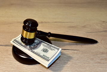 Judge hammer and bundles of dollars. Justice in courtroom. Mallet of judge on law theme and legal...