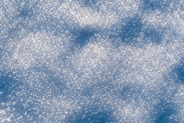 Abstract background texture with small ice crystals illuminated by sunbeams