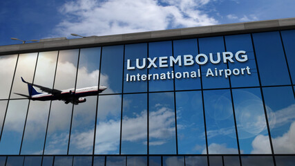 Airplane landing at Luxembourg airport mirrored in terminal - obrazy, fototapety, plakaty