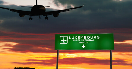Plane landing in Luxembourg airport with signboard