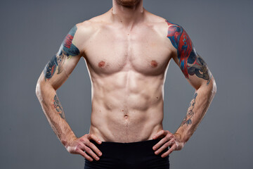 Fototapeta na wymiar pumped up press tattoo on arm cropped view of workout fitness