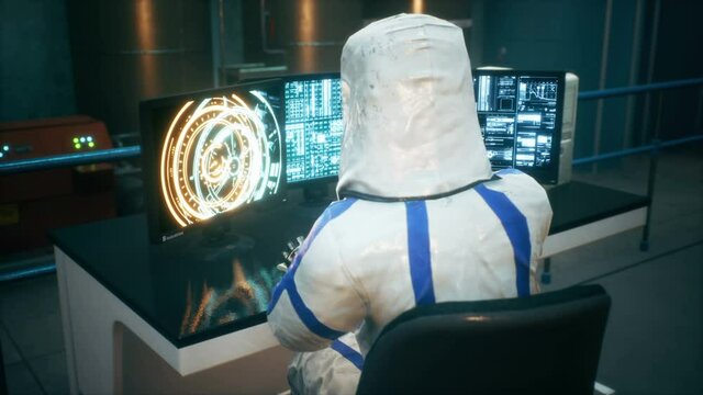 Physicist working at a computer and operating a sci-fi fusion reactor to generate endless energy. The animation is for fantastic, the futuristic or scientific backgrounds. Physicist scientist at work.