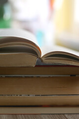 Stack of old books on a table. Selective focus.