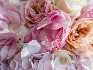 Gorgeous bouquet of roses, peonies and hydrangea with decorative dried flowers. Spring flowers.