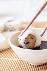 Sushi roll with soy sauce