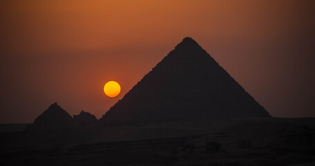 sunset over pyramids