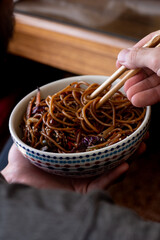 hand holding chopsticks