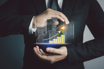 Business people are using Stock chart innovative technology. Mixed media, digital and online concept.