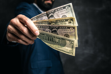 businessman gives money