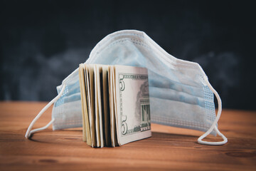 mask and dollar bills