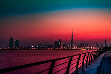 Fototapeta na wymiar sunset with dubai skyline orange and teal