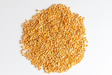 Yellow split peas isolated on white background.