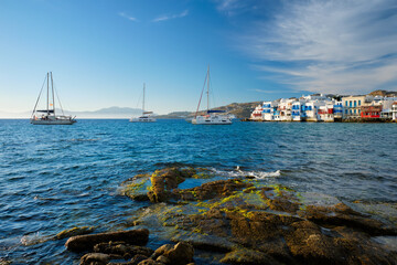 Sunset in Mykonos, Greece, with cruise ship and yachts in the harbor