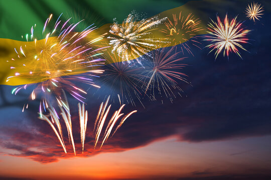 Night sky with fireworks and flag of Gabon - Powered by Adobe