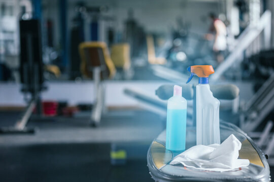 Antibacterial gel in the gym. Risk area for disease outbreak , it for washing hands to stop spreading covid-19 for public health safety. Concept hygiene hands, Gym. - Powered by Adobe
