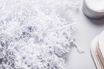 Fototapeta na wymiar Lot of white shredde paper filler for packaging