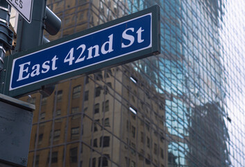 Fototapeta na wymiar 42nd street Manhattan New York City sign, on skyscraper building
