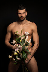 Handsome sport sexy stripped guy portrait on isolated black background