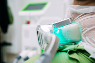 Selective focus image of Cryolipolysis, fat freezing treatment for weight loss. New slimming...