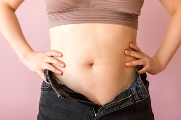 woman measuring her waist