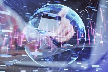 Double exposure of man hands holding a credit card and Forex graph drawing. Stock trading and digital fintech in Internet E-commerce concept.