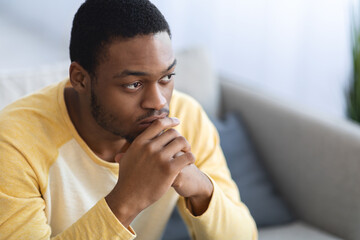 Troubled black guy looking at copy space