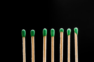matches standing in a row on black background  - Image