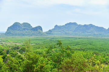 Fototapeta na wymiar View of Lush Green Mountains from Wat Kaew Prasert in Chumphon Province