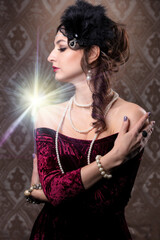 Retro woman portrait. Luxurious lady in vintage style from 20s or 30s. Photo of a girl in vintage...
