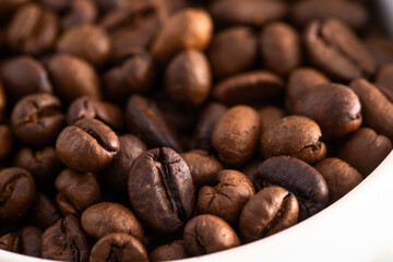 Close up of roasted coffee beans background. Detail and texture for design.