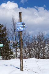 Tourist signs. Winter landscape, Racos, Brasov county, Romania.