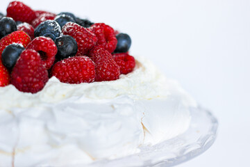 Obraz na płótnie Canvas Pavlova cake with meringue, cream and red berries