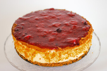 cheesecake with red berries and a biscuit base