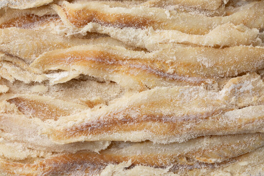 Dried and salted cod full frame close up  as background 